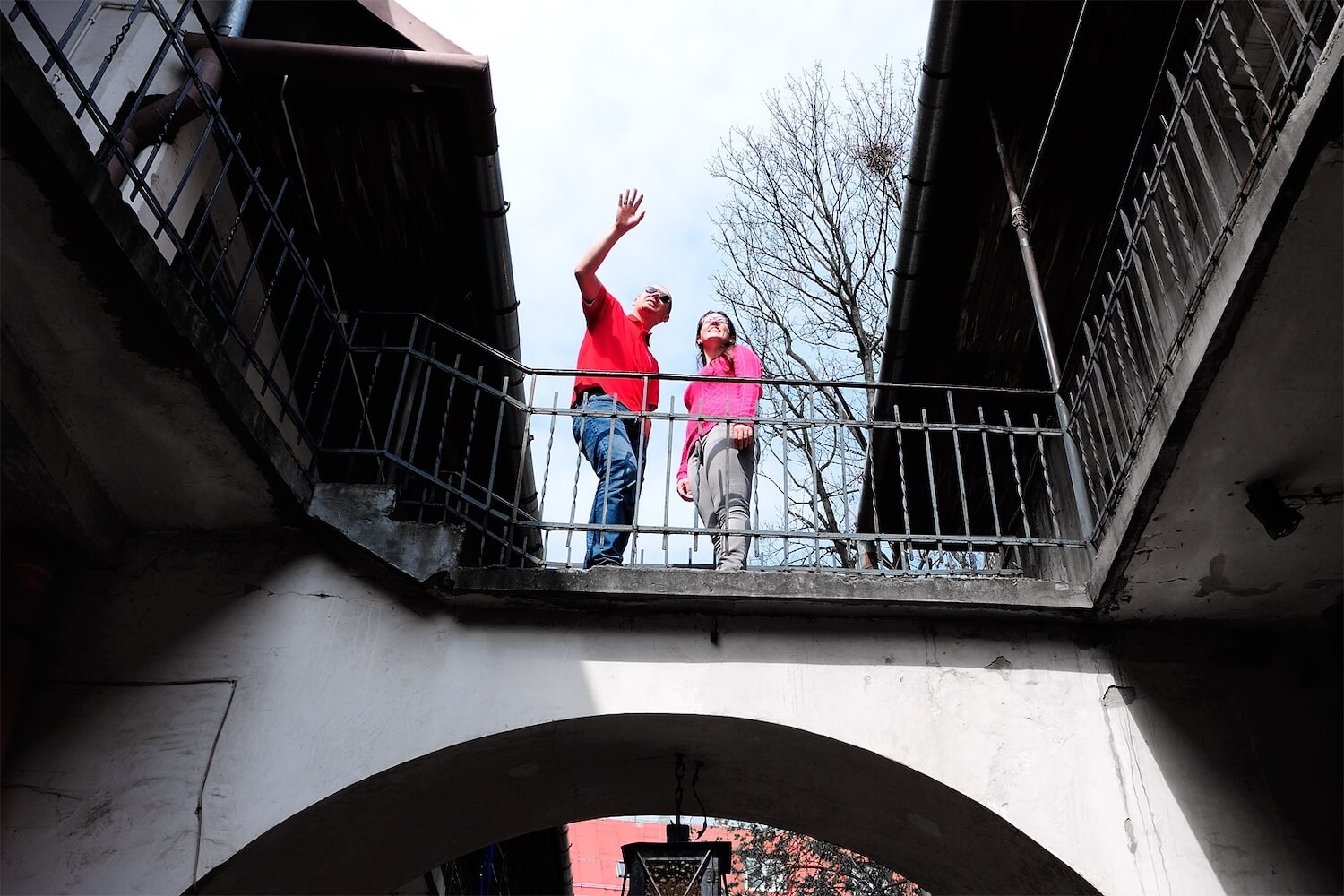 Private guide showing guests around a historic courtyard in Krakow during an extended private city tour.