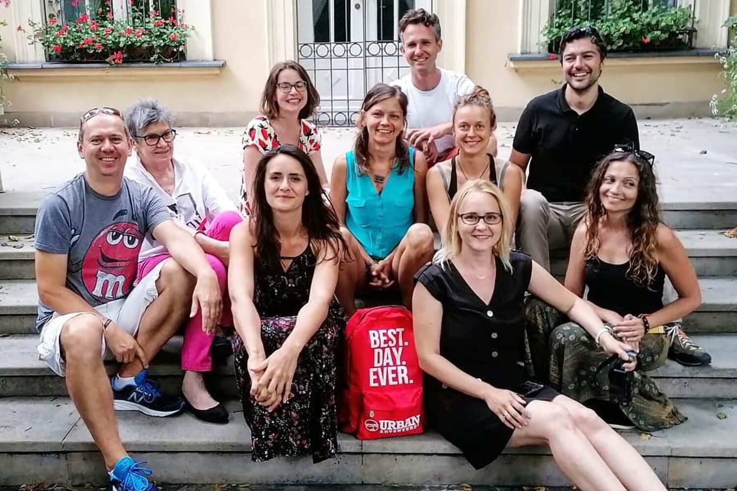 Krakow Urban Tours team sitting together outdoors during a team gathering in Krakow.